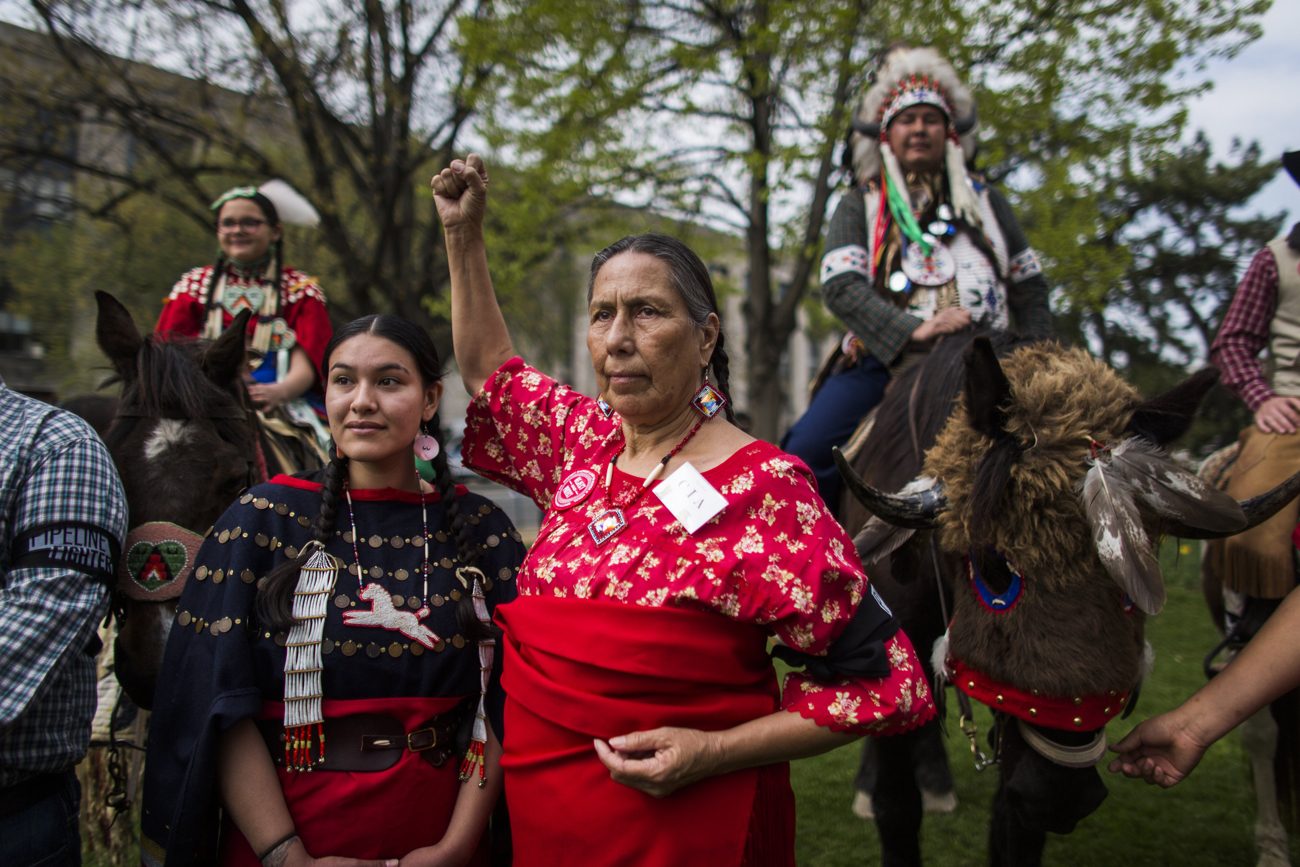 Samantha Jones of the Sicangu Lakota band of the Rosebud Sioux, left, and Casey Camp of the Ponca Nation are seen in Washington in this 2014 file photo. The Jesuits are returning more than 500 acres in South Dakota to the Rosebud Sioux. (CNS photo/Jim Lo Scalzo, EPA)