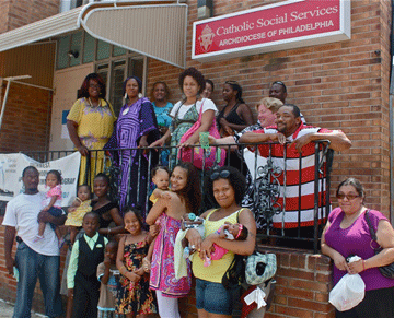 Families outside one of the Catholic Social Services centers in the Archdiocese of Philadelphia.