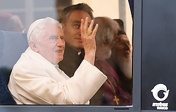 Pope Benedict XVI takes a bus with other religious leaders to the morning interfaith peace meeting in Assisi, Italy, Oct. 27. (CNS photo/Paul Haring)