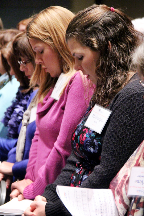 Michaelyn Hein prays along with other women attending the 2013 Catholic Women's Conference held at the Pennsylvania Convention Center on Saturday, Dec. 7. This year's event will be Oct. 29 at the Shrine of Our Lady of Czestochowa in Doylestown. (Sarah Webb)