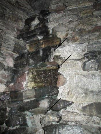 A view of the interior of the west tower of the church shows the path of water infiltration and the separation of the masonry.