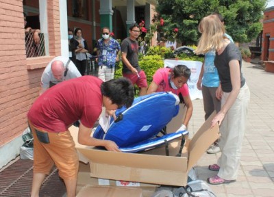 Caritas staff from Poland and Nepal check earthquake relief material packets at Assumption Catholic Church in Lalitpur, Nepal, May 7. (CNS photo/Anto Akkara)  