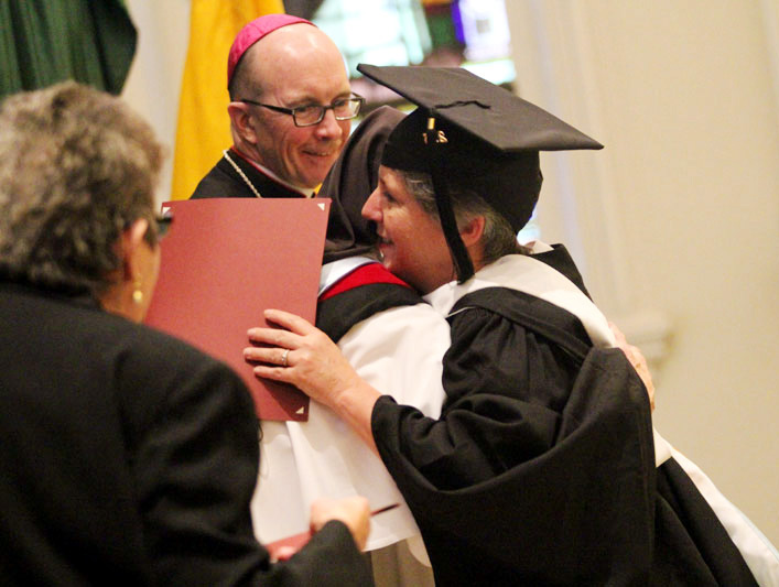 Christine Rizzo can't resist hugging Mother Assumpta Long, O.P. after she recives her Master of Arts Degree