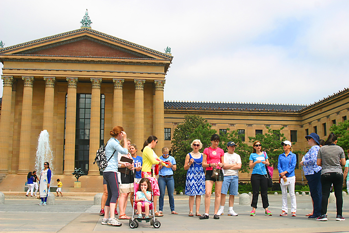 The group prays the rosary publicly at the Philadelphia Museum of Art.