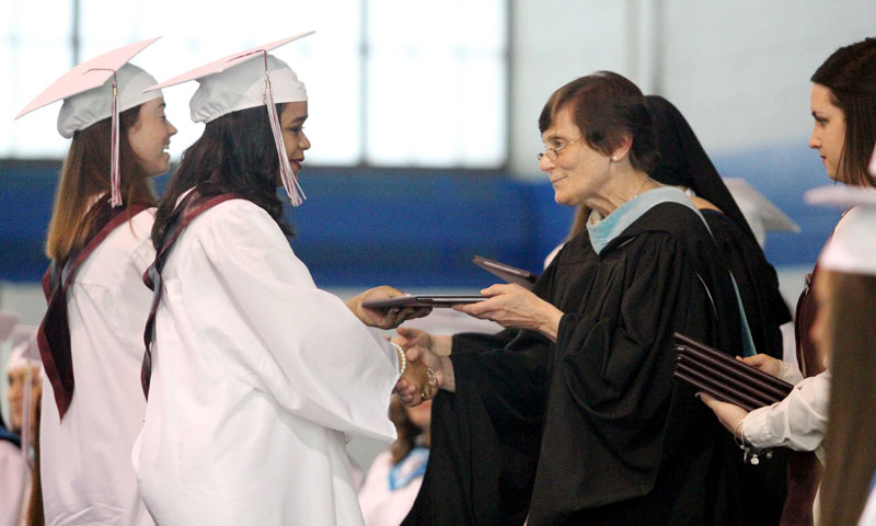 Principal Sr. Kathleen Klarich RSM (along with President Sr. Donna Shallo IHM) present diplomas