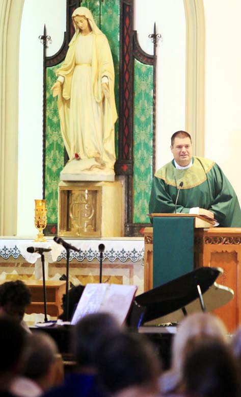 Fr Tom Whittingham address the congregation after mass