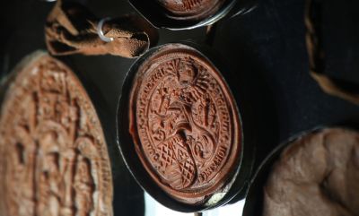 Wax seals of members of the English House of Lords are seen on a letter from the Vatican Secret Archives. Addressed to Pope Clement VII, the letter pleads for the annulment of the marriage of King Henry VIII and Catherine of Aragon. (CNS photo/Vatican Secret Archives)