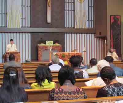 Franciscan Father Greg Plata and congregation listen to Scripture reading during Sunday Mass at St. Francis of Assisi Catholic Church in Greenwood, Mississippi, June 1, 2014. The church is one of two parishes and three missions for which Father Plata is responsible. (CNS photo/Patricia Zapor)