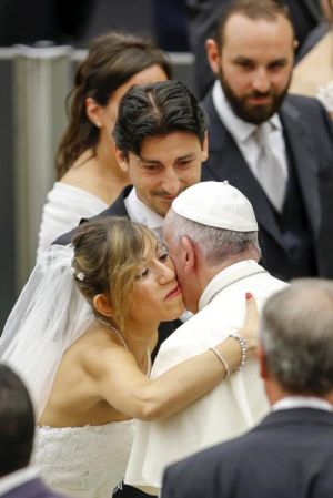 Pope Francis greets newly married couples during his weekly audience in Paul VI hall at the Vatican Aug. 5. (CNS photo/Giampiero Sposito, Reuters) See POPE-AUDIENCE Aug. 5, 2015.