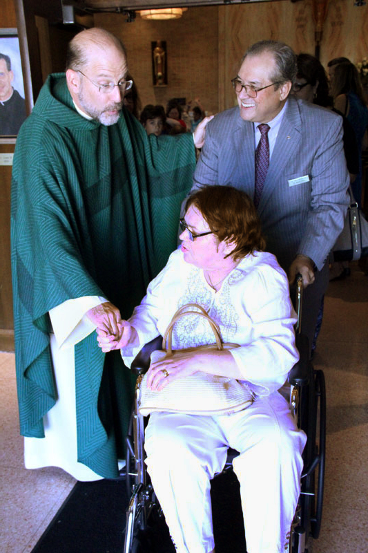 Fr Hallinan greets Michael and Peggy Granwehr