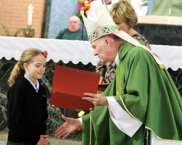 Julia Thomson from St Laurentius School in Philadelphia  receives her Archdiocesan award from Bishop Fitzgerald.
