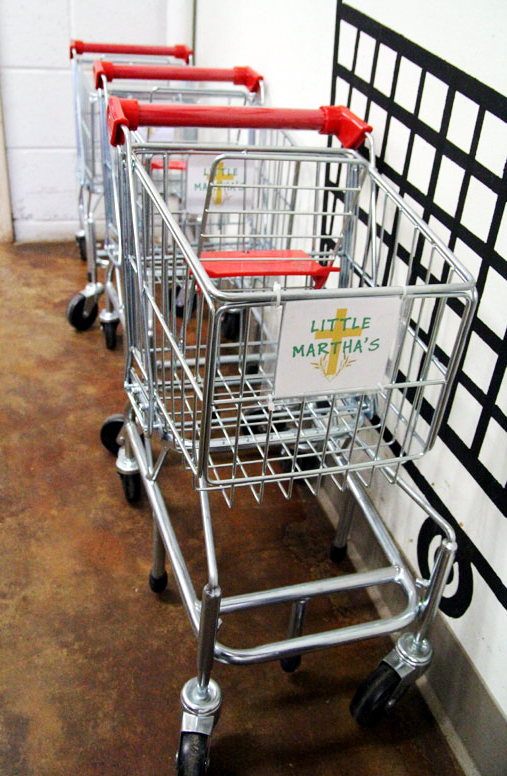 Small shopping carts are provided for children so they can shop for their own food along side their parents.