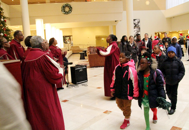 Saint Charles Borremeo Choir perform in the lobby as children arrive.