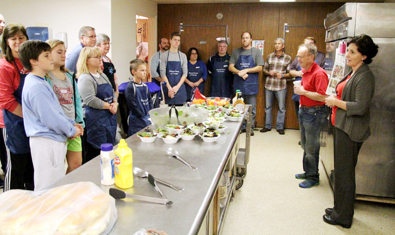 Catholic parishioners serve meals and make friends at Coventry ...