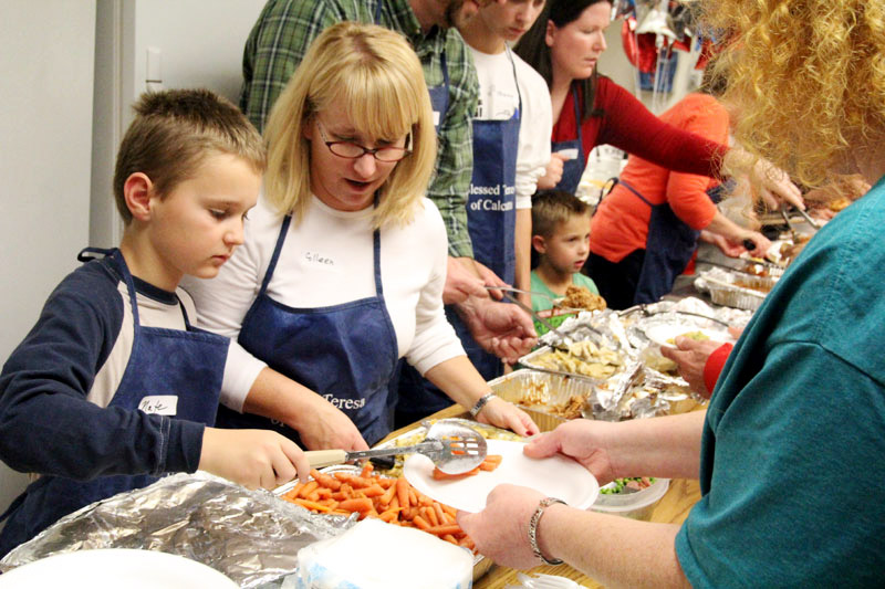 Volunteers of all ages serve those in need at Coventry Christian Church during the Year of Mercy.