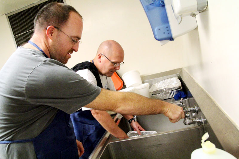 Tim Beehler and Deacon David Kubczak do their part by keeping up on the dish washing.