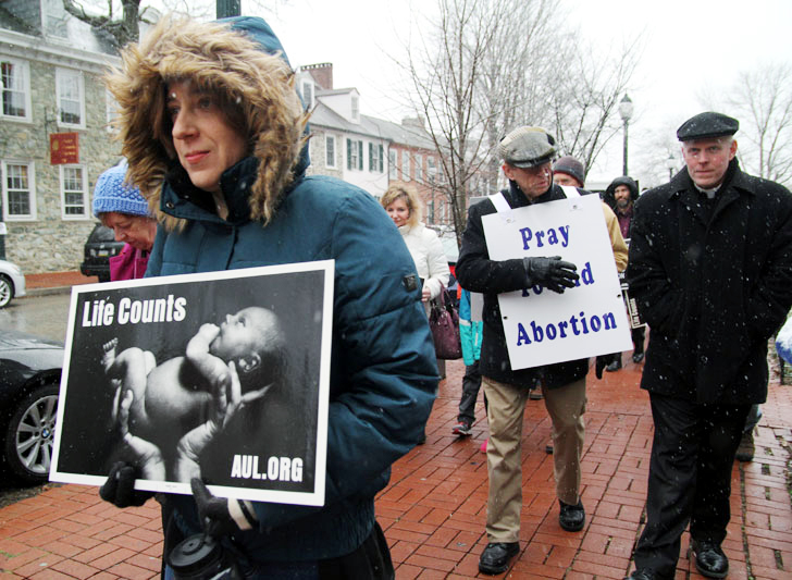 ProLife supporters from Chester County silently march in the snow from Saint Agnes Church in West Chester to the steps of the Chester Courthouse.