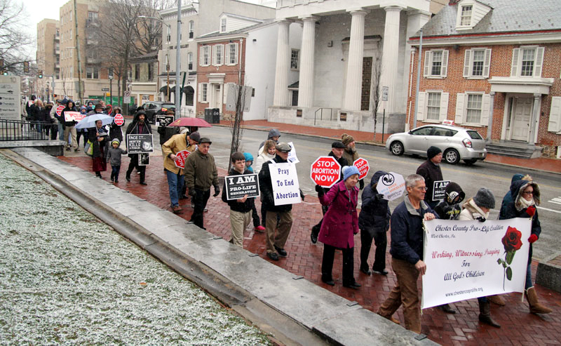 ProLife supporters from Chester County silently march in the snow from Saint Agnes Church in West Chester to the steps of the Chester Courthouse.