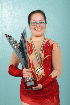 Lani DeMello, 30, pictured in a Dec. 8 photo, earned the title of World Champion in Rhythmic Gymnastics at the Down Syndrome International Gymnastics World Championships in Mortara, Italy. DeMello, a parishioner at Holy Trinity Church in Peachtree City, Ga., earned a silver medal performing with the ribbon in the event. (CNS photo/ Michael Alexander, Georgia Bulletin)