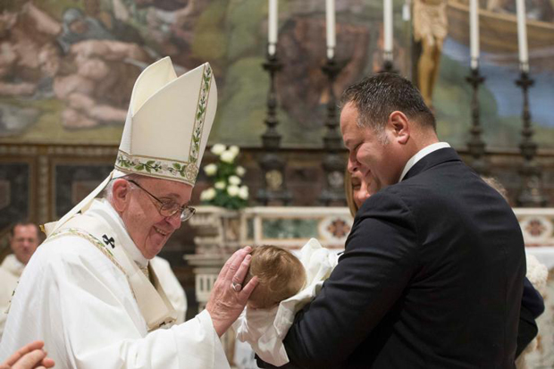 Pope Francis blesses an infant during the baptism of 23 babies in the Sistine Chapel at the Vatican Jan. 10. The baptisms were held on the feast of the Baptism of the Lord. (CNS photo/L'Osservatore Romano, handout) See POPE-BAPTISM Jan. 11, 2016.