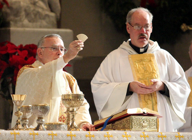 Archbishop Charles Chaput and Fr Richard Bennett, CSsR, pastor, celebrate Mass on the feast of Saint John Neumann.