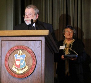 Father William Grogan, pastor of Holy Cross Parish in Philadelphia, accepts the Serra Club award for his father Bill Grogan who died last year.