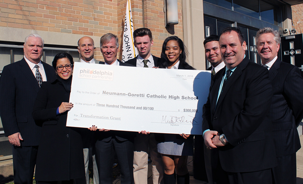 Proudly displaying the award of $300,000 SS. John Neumann and Maria Goretti High School from the Philadelphia School Partnership are students, school officials, PSP representatives, civic leaders and officials of the Philadelphia Archdiocese March 1 at the school in South Philadelphia.