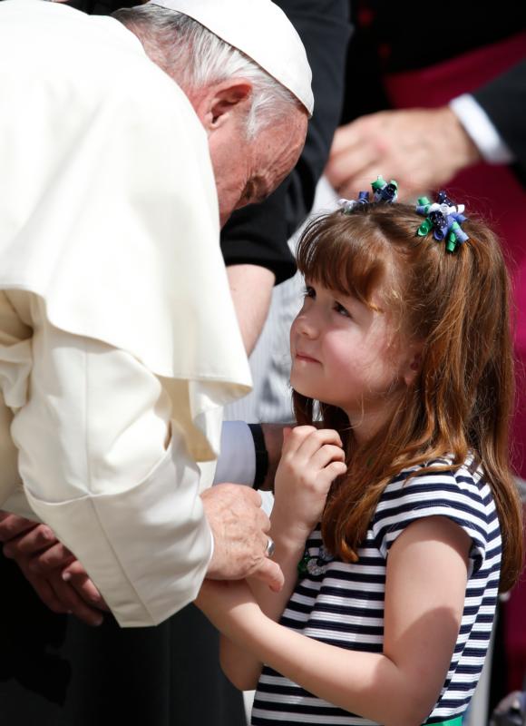 Pope Francis greets Lizzy Myers of Mansfield, Ohio, during his general audience in St. Peter's Square at the Vatican April 6. Myers, who has a disease that is gradually rendering her blind and deaf, met the pope as part of her "visual bucket list." (CNS photo/Paul Haring) 