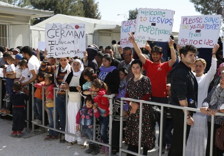 Refugees attend a meeting with Pope Francis at the Moria refugee camp on the island of Lesbos, Greece, April 16, 2016. (CNS photo/Paul Haring) 