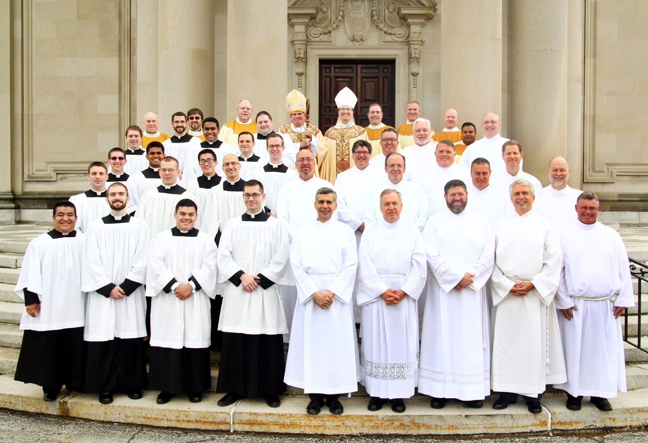 The seminarians from all dioceses and the permanent deacon candidates pose after the Mass May 7 at St. Charles Seminary with presiding Bishop David O'Connell (rear, center left), seminary rector Bishop Timothy Senior (rear, center right) and seminary faculty members. (Sarah Webb)