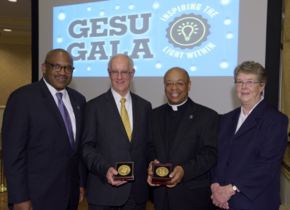 At the Gesu Gala May 5 are, from left, Bryan H. Carter, president and CEO of Gesu School; Peter G. Gould, Gesu Spirit Medal recipient and board member of the school; Father Stephen D. Thorne, Gesu Spirit Medal Recipient and board member; and Sister Ellen Convey, I.H.M., principal of Gesu School.