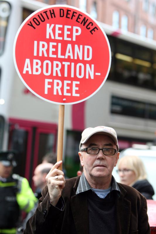 A pro-life supporter demonstrates in 2012 outside the Marie Stopes clinic in Belfast, Northern Ireland. The Catholic bishops of Northern Ireland have described as "profoundly disquieting" a ruling by the High Court that the region's ban on abortion in all but very limited circumstances breaches human rights legislation. (CNS photo/Paul Mcerlane, EPA) 