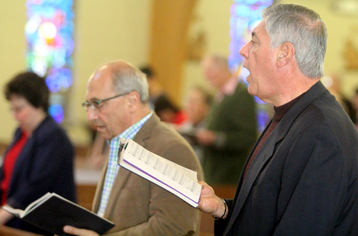 Charles Palladino and John A Koury, Jr. fill the church with their voices during the entrance procession.