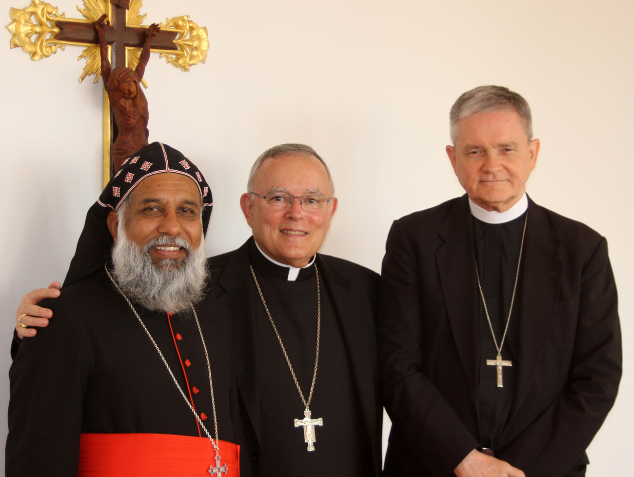 From left, Cardinal Baselios Cleemis, major archbishop of the Syro-Malankara Catholic Church, meets June 22 in Philadelphia with Archbishop Charles Chaput and Archbishop Edward Adams, a Philadelphia native priest and currently the Vatican’s apostolic nuncio to Greece, who coincidentally was in Philadelphia.