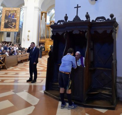 Pope Francis listens to a confession in the Basilica of St. Mary of the Angels Basilica in Assisi, Italy, Aug. 4. (CNS photo/L'Osservatore Romano via Reuters)