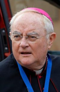 Archbishop Henryk Hoser of Warsaw-Praga, Poland, arrives for the morning session of the Synod of Bishops on the familyin 2015 at the Vatican. Poland' s Catholic Church has reiterated support for stricter abortion controls, after parliamentarians voted down a law that would have sent aborting mothers to jail.(CNS photo/Paul Haring) See POLAND-ABORTION-RESTRICTIONS Oct. 7, 2016.