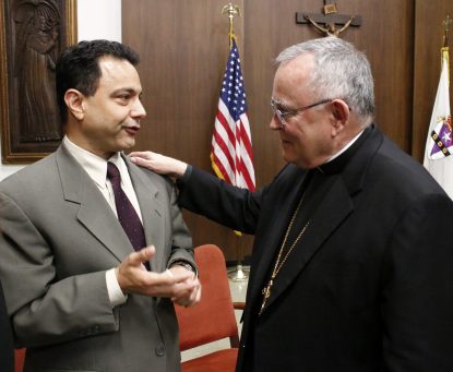Archbishop Charles Chaput (right) chats with Peter Sciarra, who spoke about his experience with post-abortion healing at a press conference Oct. 3 announcing the launch of Project Rachel in the Archdiocese of Philadelphia.