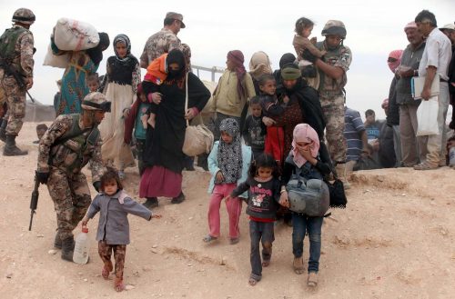 Syrian refugees arrive at a camp after crossing into the Jordanian side of the northeast Jordan-Syria border near Royashed. (CNS photo/Jamal Nasrallah, EPA) 