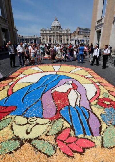 A floral rendition of Mary decorates the area outside St. Peter's Square at the Vatican June 29. The words of the angel Gabriel, spoken to Mary in the Gospel of Luke (1:37), precede the most faith-filled response in all of Scripture: "May it be done to me according to your word." (CNS photo/Paul Haring) 