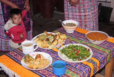 Women in Momostenango, Guatemala, experiment  with new recipes for the varied crops they raise in this Oct. 7 photo. Among the favorites are lima beans in red sauce, cauliflower and broccoli breaded with egg, pickled broccoli salad and chamomile tea for children instead of coffee. (CNS photo/Judith Sudilovsky)