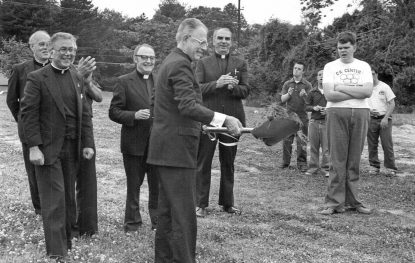 5/9/1982: At the groundbreaking for the new addition to the CK Center in SPringfield, Delaware County on May 9, 1982, Bishop Lohmuller tosses the first spadeful of soil in the construction. (Photo from the Robert and Theresa Halvey Photograph Collection 