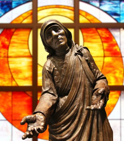 A statue of St. Teresa of Calcutta from her namesake parish in Limerick, Montgomery County is superimposed on a stained glass window from St. Alphonsus Church, Maple Glen, in this photo illustration by CatholicPhilly.com staff photographer Sarah Webb.