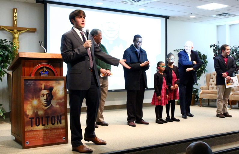 Bill Rose, director and producer of "Tolton," introduces those who participated in the filming of the movie.