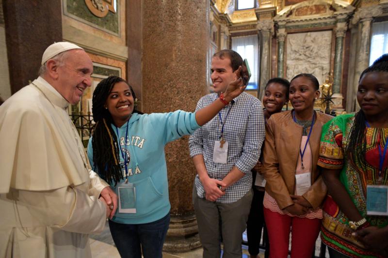 Pope Francis poses for a selfie during an evening prayer vigil with young people at the Basilica of St. Mary Major in Rome April 8. Pope Francis has chosen the theme of "Young people, faith and vocational discernment" for the next Synod of Bishops to take place in October 2018. (CNS photo/L'Osservatore Romano) 