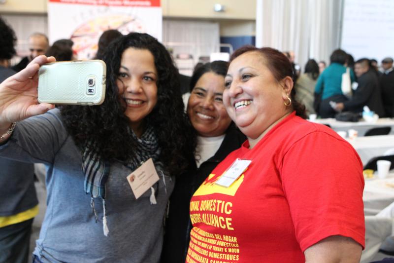 Ingrid Vaca of Dreamers Moms USA International, right, poses for a selfie with friends during a break at the U.S. Regional World Meeting of Popular Movements Feb. 18 in Modesto, Calif. It is in friendship that we can imitate Jesus' model for evangelization in ordinary life. (CNS photo/Dennis Sadowski) 