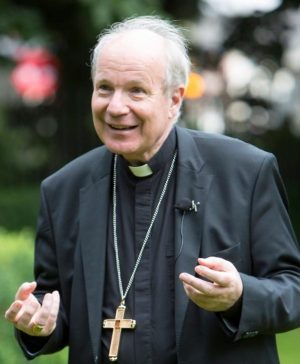 Cardinal Christoph Schonborn of Vienna talks to journalists June 13 outside St. John's Cathedral in Limerick, Ireland. The cardinal was attending a conference, "Lets Talk Family: Lets Be Family." (CNS photo/Liam Burke courtesy Press 22) 