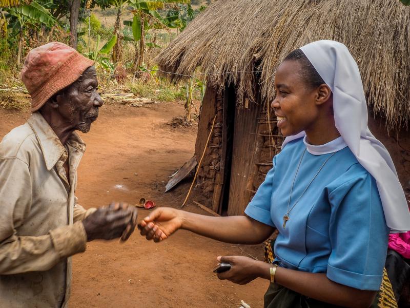 Sister Dativa Mukebita talks with Nikodem Lucian at the Village Angels of Tanzania project in Ngara, Tanzania. (CNS photo/courtesy Sergio Burani) 