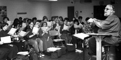 Peter LaManna rehearses the Collegiate Choir and "Alumni Chorale" for it's 25 anniversay performance. (Photo by Dennis Photography.)