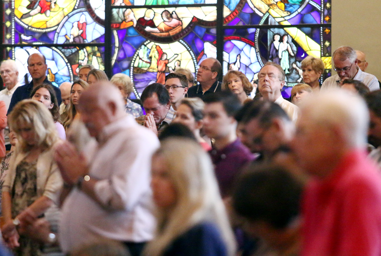 inside catholic church with people