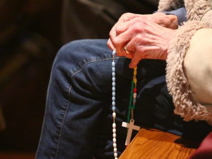 People choose to pray in various ways during silent prayer at the Holy Hour.